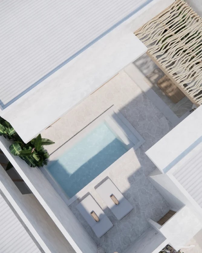 Overhead view of interior design samples including fabric swatches, paint colors, and decorative elements on white surface